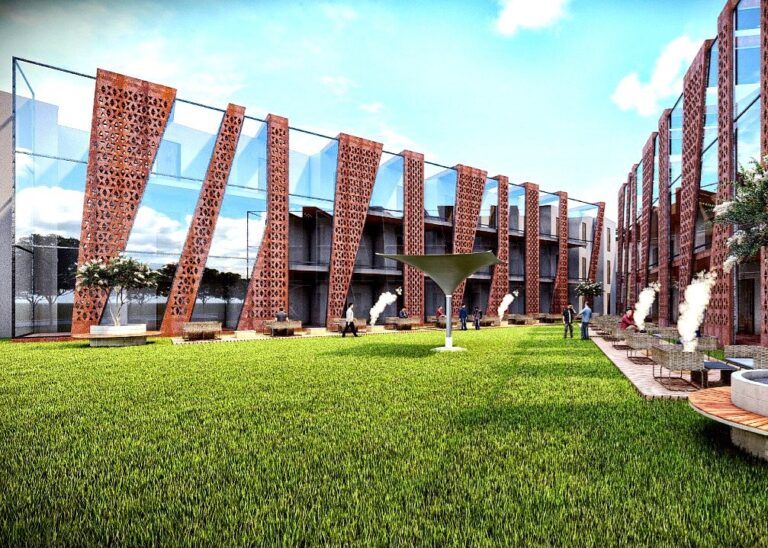 The guestroom wing of a community club, framed by corten-steel screen panels along a landscaped lawn. Designed by ZM Architects.