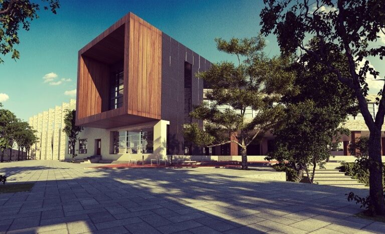 The timber-clad entrance building of the First Steps school in Faisalabad, opening onto a shaded stone courtyard. Designed by ZM Architects.