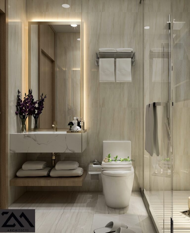 A minimalist bathroom interior with beige marble finishes and a walk-in shower, designed by ZM Architects.
