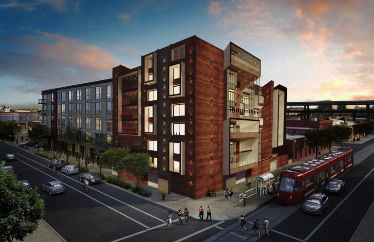 A mixed-use development with ground-floor retail and upper-level residential units along a landscaped transit corridor, designed by ZM Architects.