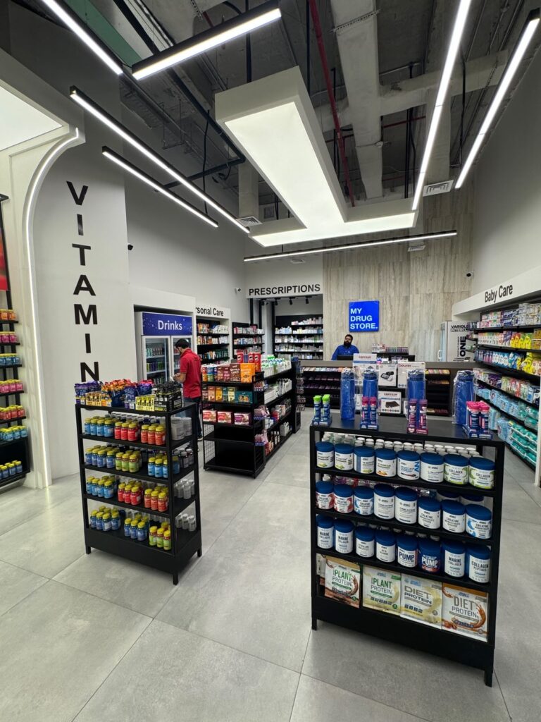 The central aisle of "My Drug Store" pharmacy in Lahore, designed by ZM Architects with arched shelving and integrated lighting.