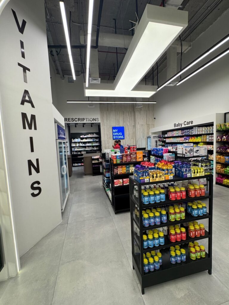 Wall-mounted vitamins signage within "My Drug Store" pharmacy in Lahore, designed by ZM Architects.
